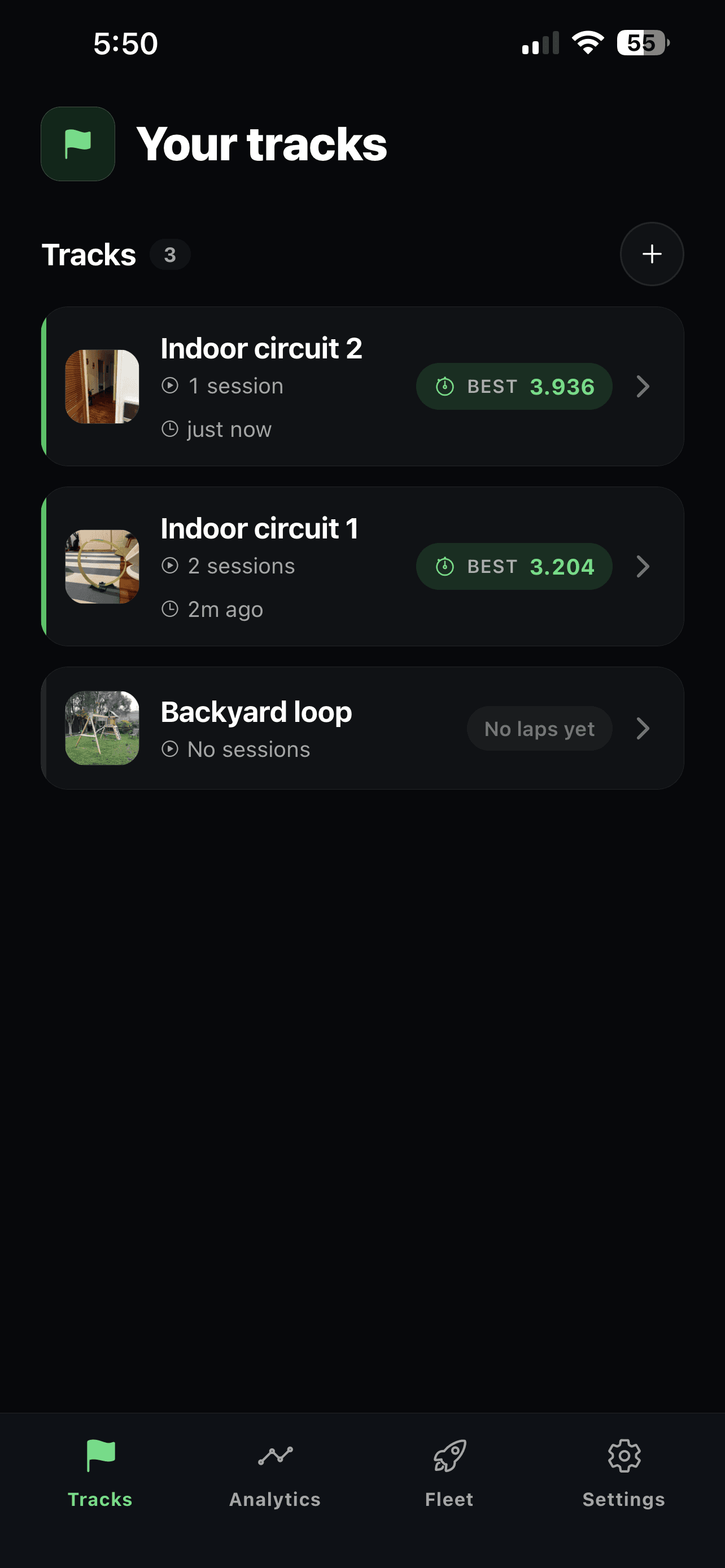 Tracks screen listing three tracks with their best lap times